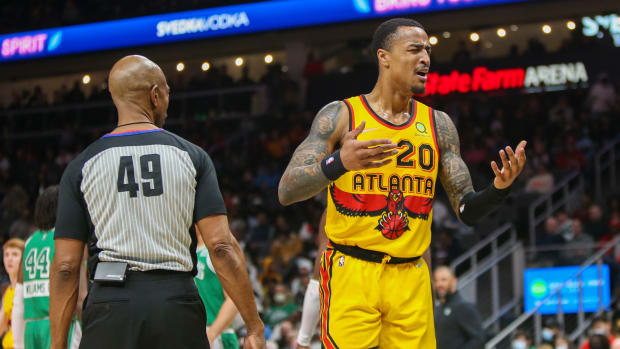 Atlanta Hawks forward John Collins reacts to a foul call during a game against the Boston Celtics.